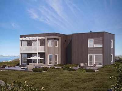 Grått, stilrent hus med flatt tak beliggende ved havet. Huset Mynd har store vinduer og veranda med pergola. Denne modellen har egen utleieenhet.