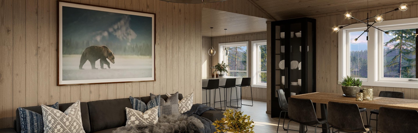 Koselig brunbeiset romslig stue og spisestue i hytta Brakar. Åpen kjøkkenløsning med moderne barløsning.