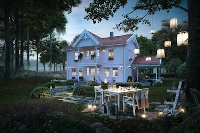 Alvheim er et hus med to plan som her er illustrert i kveldsstemning med en hyggelig sitteplass i fronten av hagen.