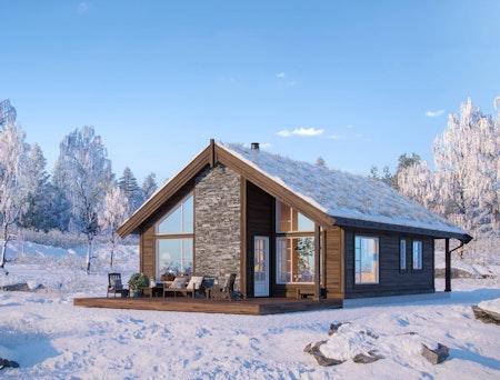 Hyttemodellen Gråhø med hems i vinterdrakt på flat tomt.